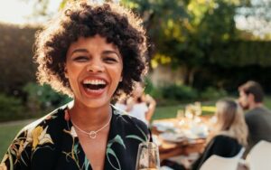 Woman with Beautiful Smile Thanks to Single Tooth Implant from Hillsboro Dental Excellence