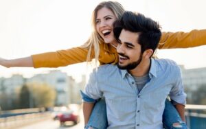 Laughing Couple Happy About Free Dental Implant Consultation with Hillsboro Dental Excellence