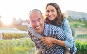 Happy Couple Shows Off Mini Dental Implants from Hillsboro Dental Excellence