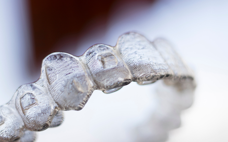 A closeup view of Invisalign's invisible braces.