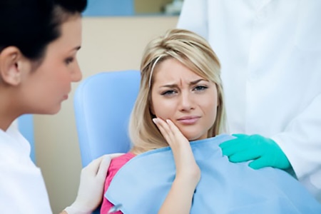 A patient having an emergency dental problem at a dentist's office.