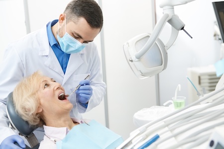 older woman receiving dental care