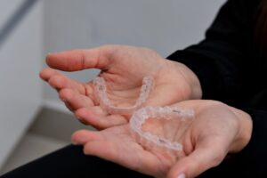 Clear aligners held in hands