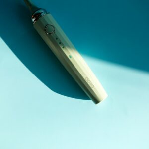 Electric toothbrush on blue background