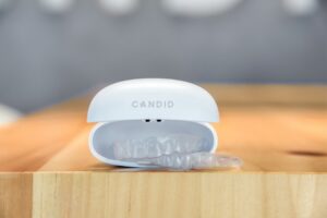 Clear aligners in branded case on table