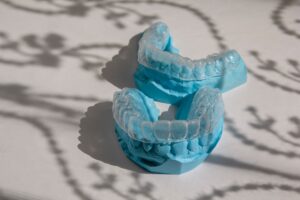 Dental molds with clear aligners displayed