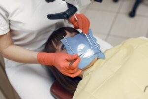 Dentist preparing for dental procedure