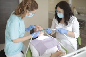 Dental team performing oral examination