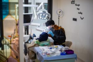 Dentist performing procedure in dental office